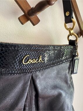 Coach Black Leather Shoulder Bag with Gold Hardware.